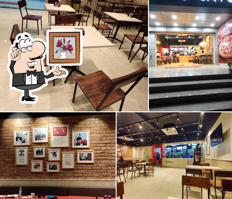 Take a seat at one of the tables at Domino's Pizza Bhetapara, Guwhati
