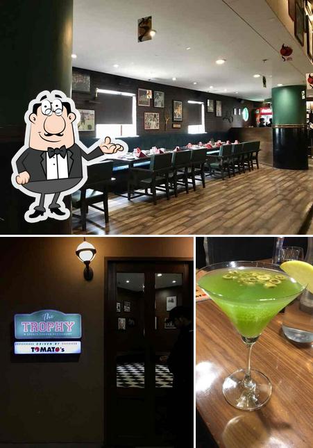 Check out the image displaying interior and beverage at The Trophy by Quint Hospitality