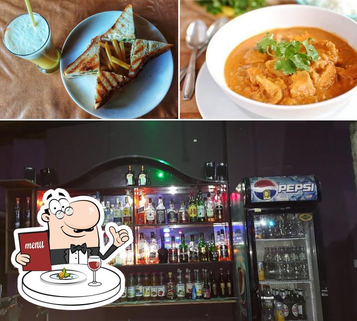 Among different things one can find food and bar counter at Sai Jc Restaurant And Bar