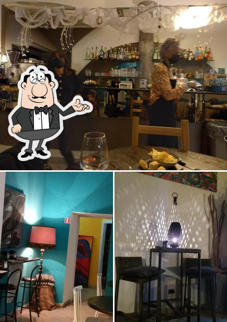 Questa è la foto che presenta la interni e tavolo da pranzo di Bar Hollywood