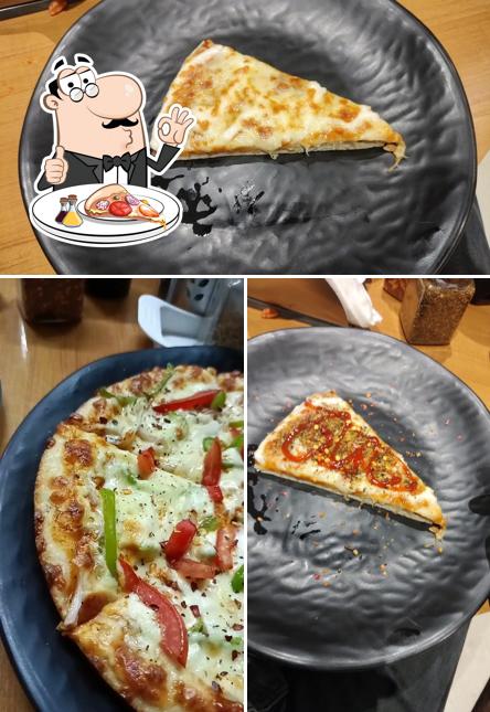Try out pizza at Pizza Hub
