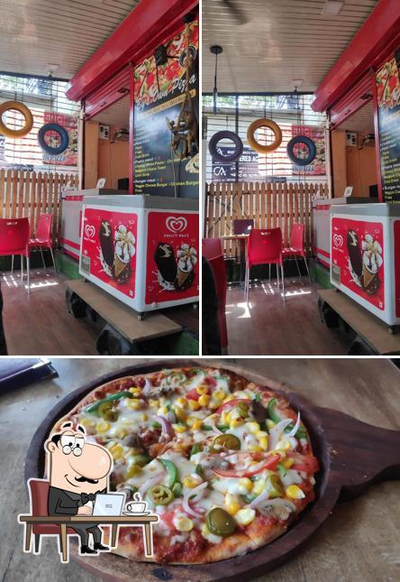 The picture of interior and pizza at By's own pizza