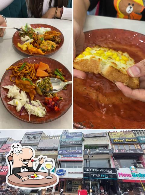 Take a look at the picture depicting food and exterior at Captain Sam's Pizza Phase 7