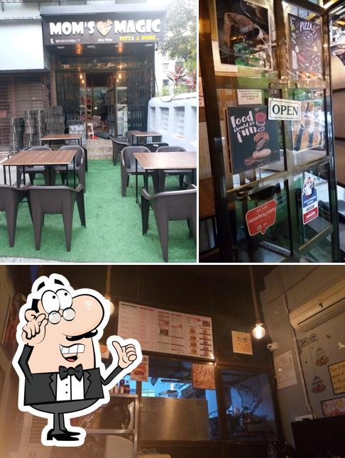 This is the picture depicting interior and exterior at Moms magic pizza and more