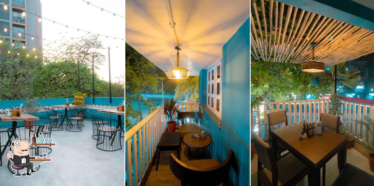 Take a seat at one of the tables at Sip Of Hope - The Coffee House