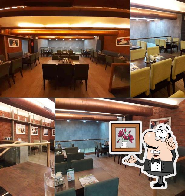 Take a seat at one of the tables at Curry Leaf Hazratganj