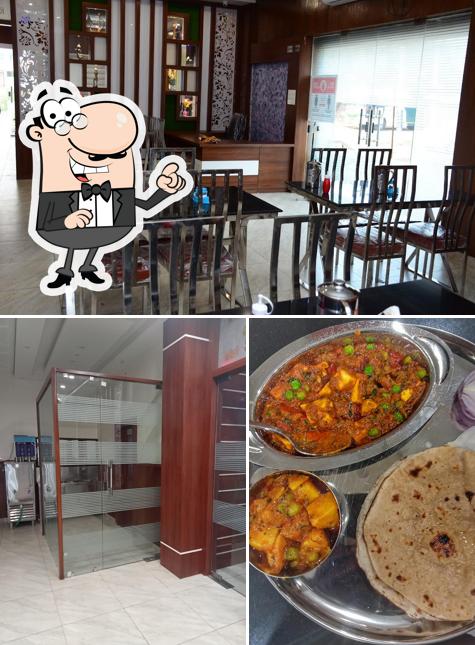 This is the image showing interior and food at Ganpati Restaurant