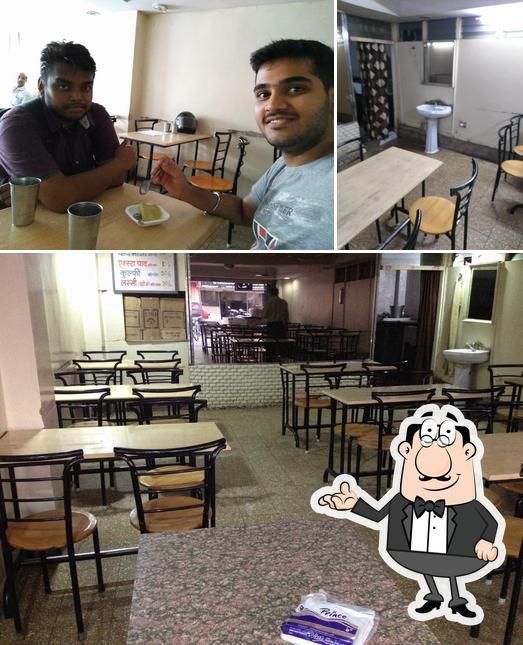 Take a seat at one of the tables at Indore Pav Bhaji & Kulfi House