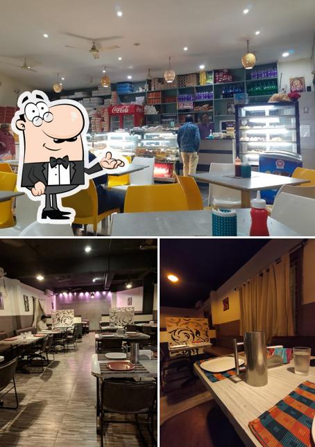 Take a seat at one of the tables at Sri Nagarjuna Masala Bowl