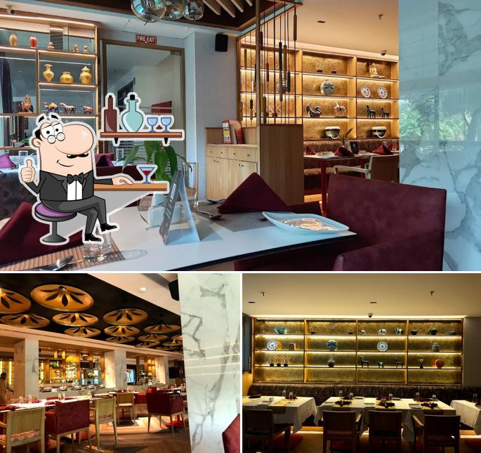 Take a seat at one of the tables at The Gourmet Restaurant, Bhubaneswar