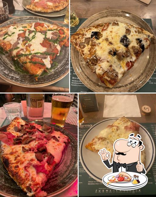 A Karma pizza al trancio con forno a legna, puoi provare una bella pizza