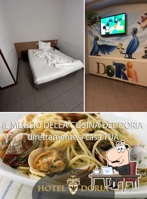 La immagine della interni e cibo di Hotel Doria Ristorante