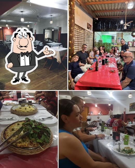Sente em uma das mesas no Pizzaria Arte do chef