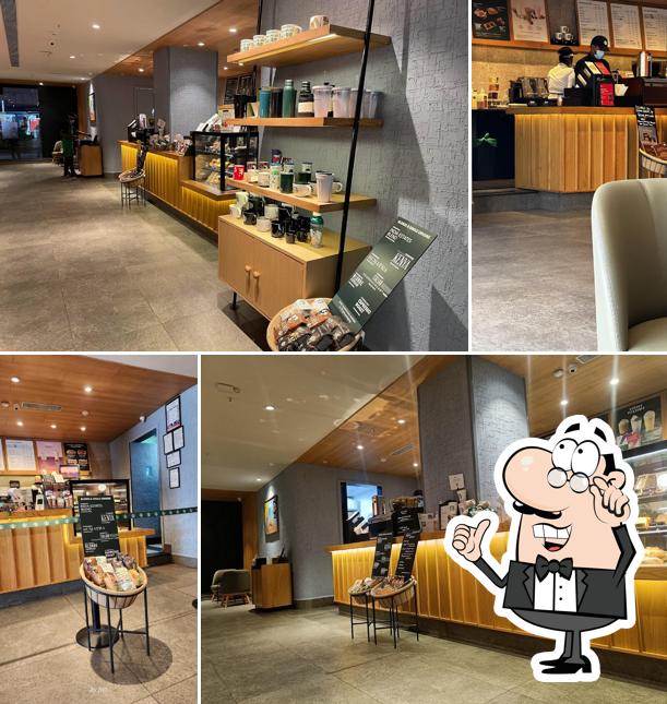 Take a seat at one of the tables at Starbucks