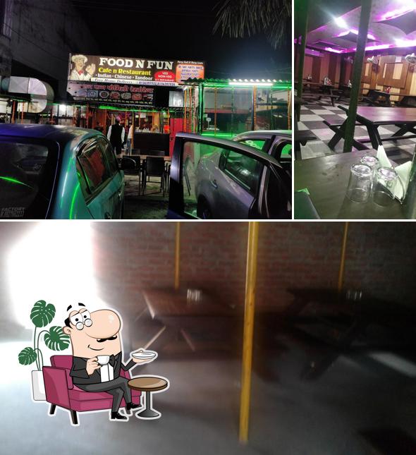 This is the picture displaying interior and dining table at FOOD AND FUN FAMILY RESTAURANT