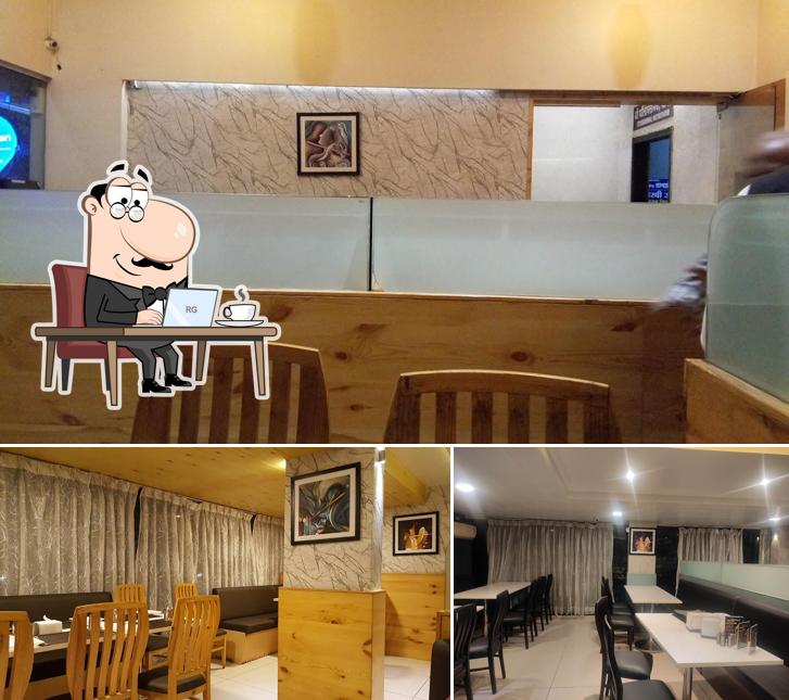 Take a seat at one of the tables at Murli Pure Veg & Ac Banquet Hall