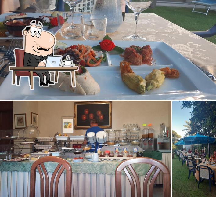 Questa è la immagine che presenta la interni e cibo di Hotel Fortunella