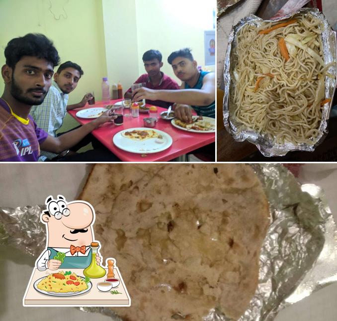 Among different things one can find food and dining table at Foodaholic