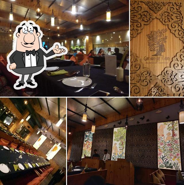 Take a seat at one of the tables at Garden of Eden (Multi Cuisine Restaurant)