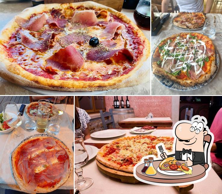 Scegli una pizza a Konoba Rustica