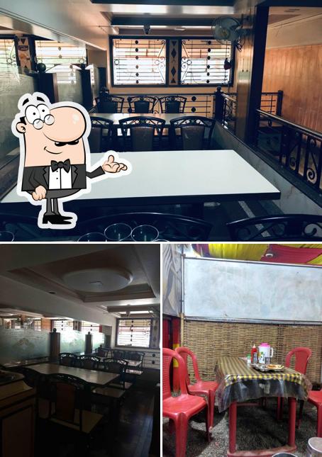 Take a seat at one of the tables at Swadishta (Swad )Veg Restaurant