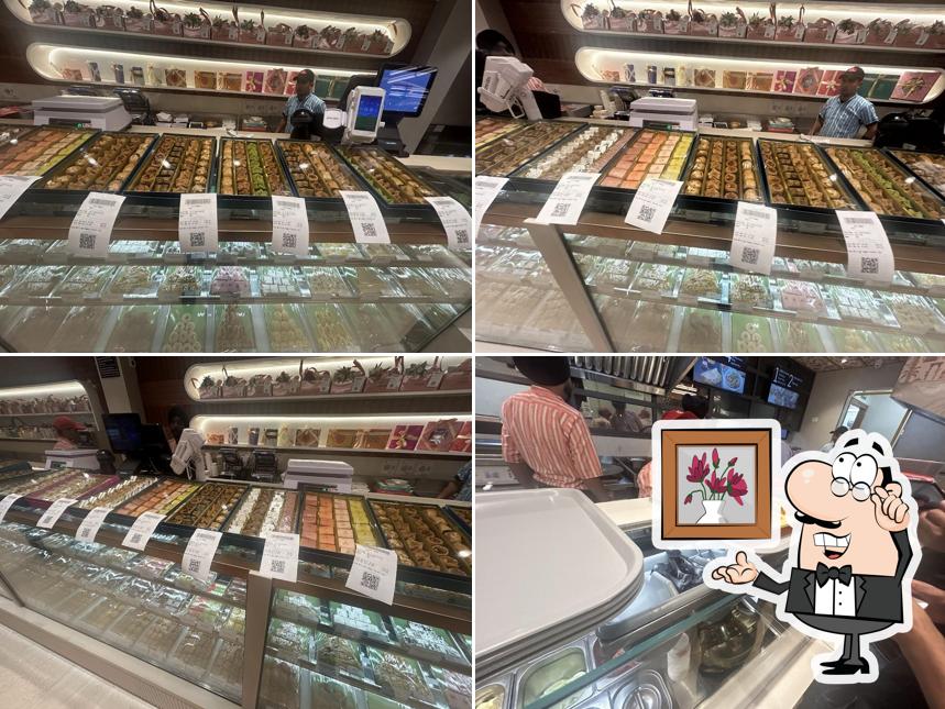 Take a seat at one of the tables at Haldiram's - Moga