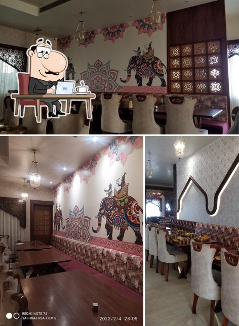 Take a seat at one of the tables at Rajwada
