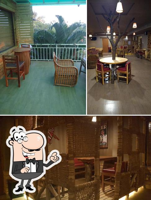 Take a seat at one of the tables at Drunken Duck Resto Bar