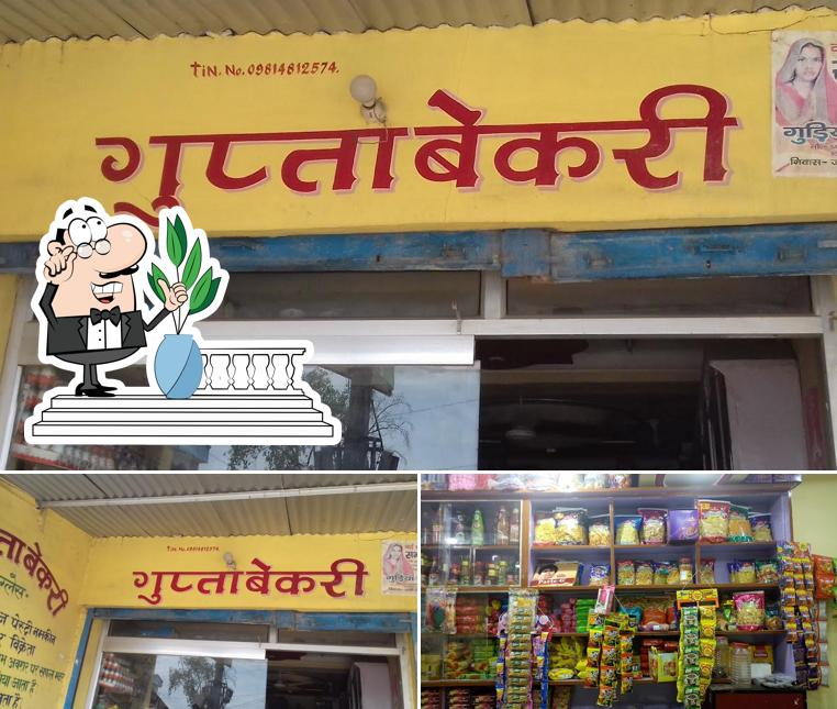 Take a look at the image displaying exterior and food at Gupta Bakery