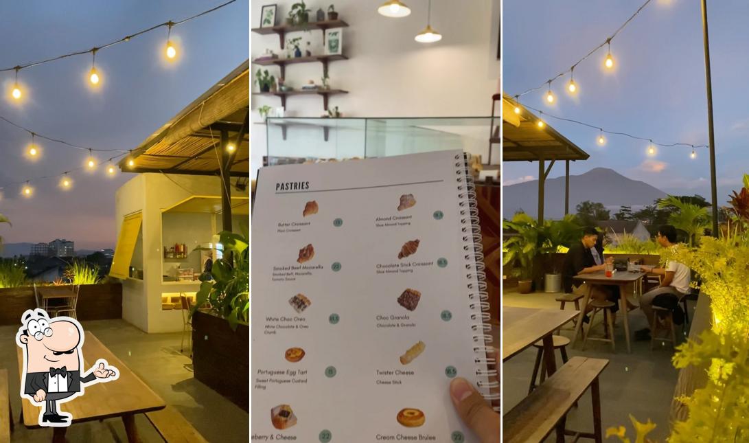 Take a seat at one of the tables at FLOTILA Rooftop Garden