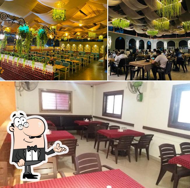 Take a seat at one of the tables at Riverview Garden Family Restobar & AC Banquet