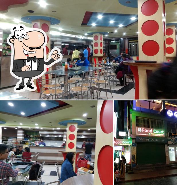 Take a seat at one of the tables at Food Court