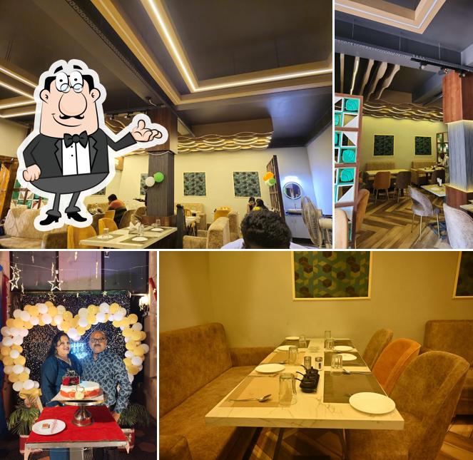 Take a seat at one of the tables at The Lotus Multi Cuisine Restaurant