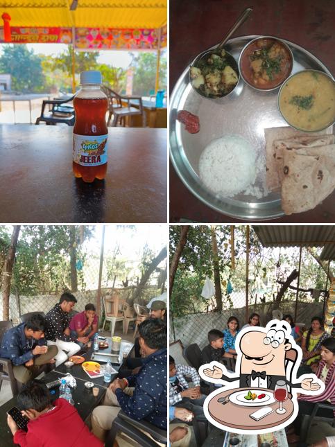 Among various things one can find dining table and food at Golden Dhaba