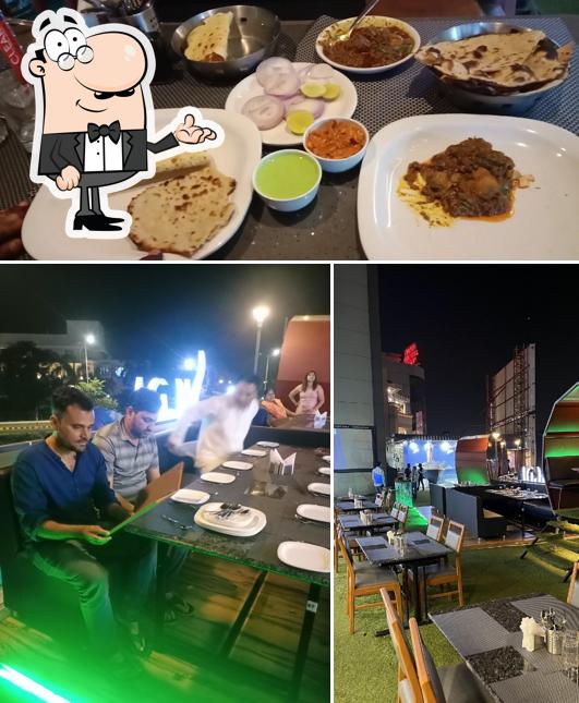 This is the photo displaying interior and food at Sigdi Restaurant Ahmedabad