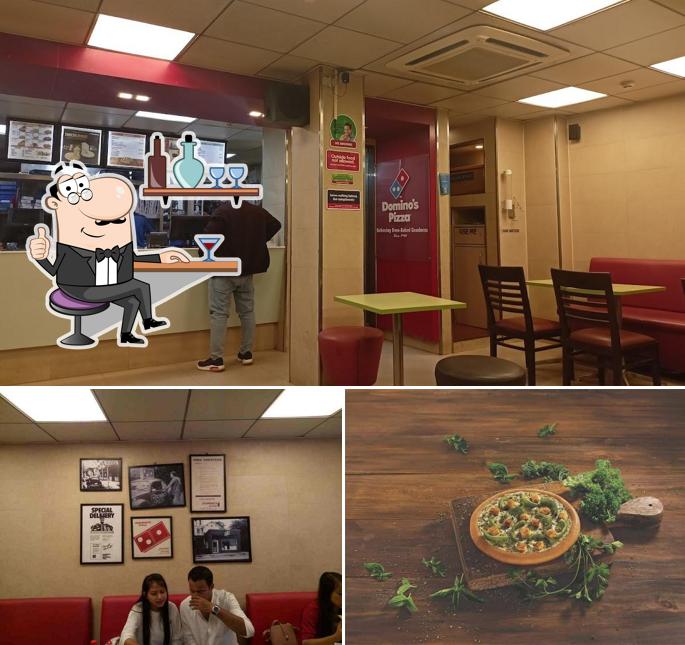 Take a seat at one of the tables at Domino's Pizza Six Mile, Guwahati