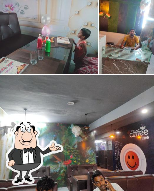 The picture of MADHUR MILAN FAMILY RESTAURANT’s interior and dining table