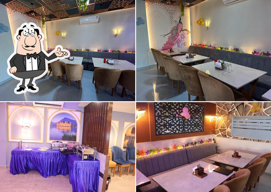 Take a seat at one of the tables at SURYAA RESTAURANT