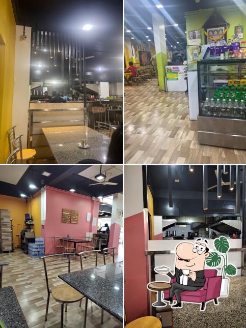 Take a seat at one of the tables at Shree Akshayam Veg Kitchen