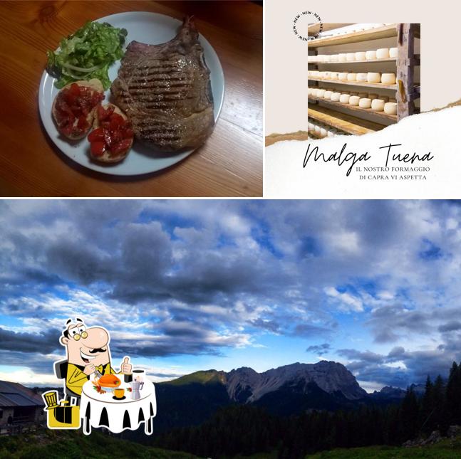 La immagine della cibo e esterno di Malga Tuena