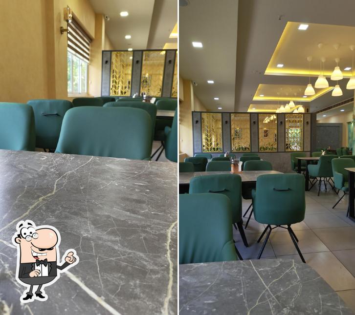 Take a seat at one of the tables at Chicking Haripad Take a seat at one of the tables at Chicking Haripad