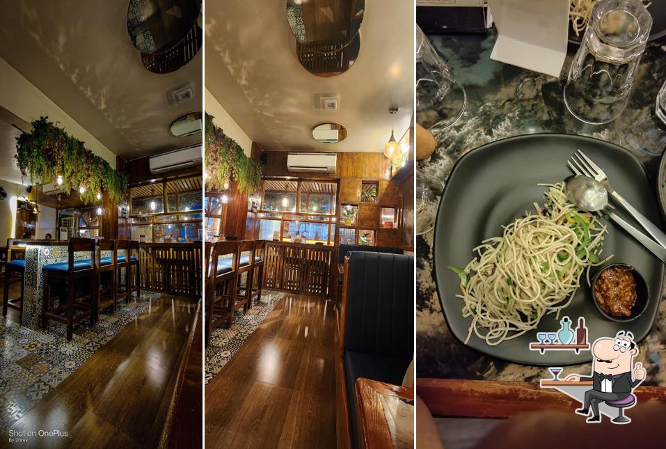Take a seat at one of the tables at Y Cafe Ambernath