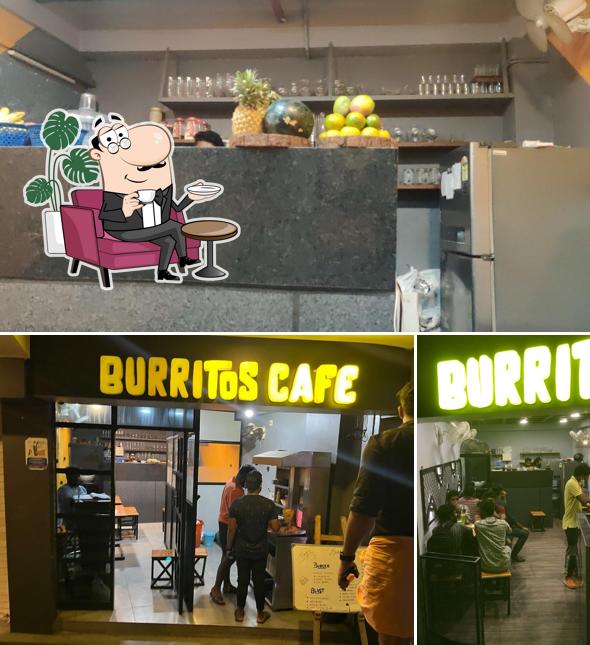 Take a seat at one of the tables at Burritos Café Shawarma Cafe