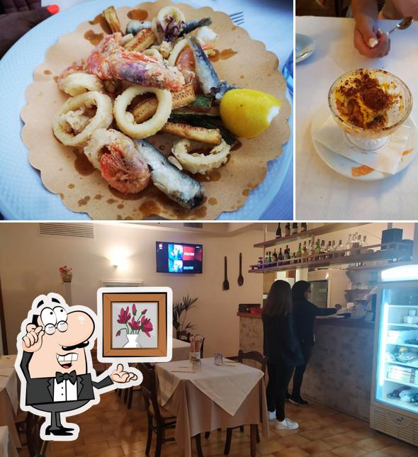 Siediti a un tavolo di Pizzeria trattoria la rotonda