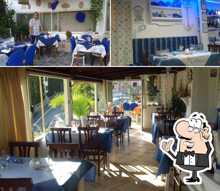 Siediti a un tavolo di Trattoria di pesce Il Giardino