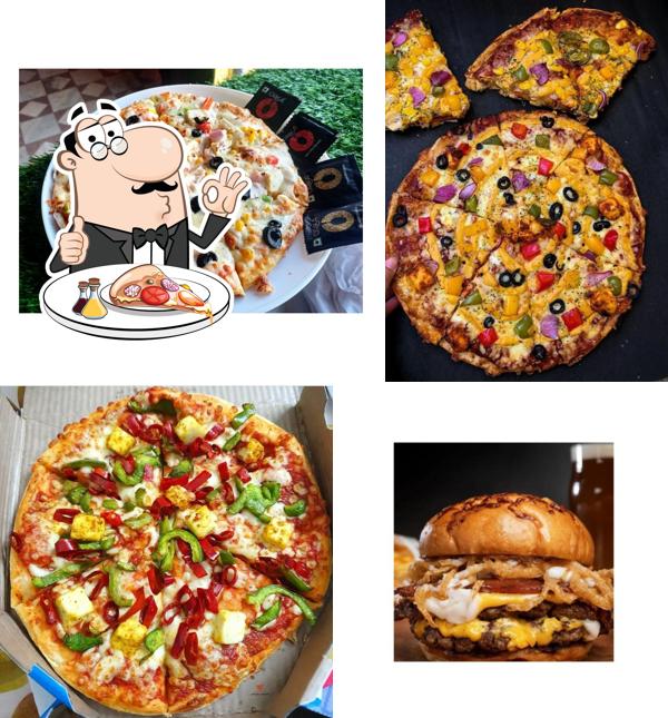 Get pizza at Guftagu Cafe & Restaurant