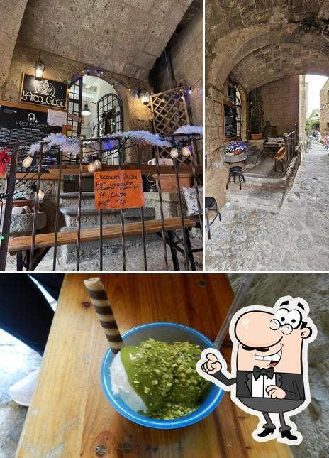 Dai un’occhiata alla foto che presenta la interni e cibo di L'Arco del Gusto