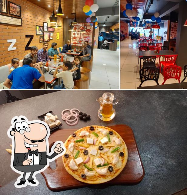 The image of interior and pizza at Pizza Zone Morbi