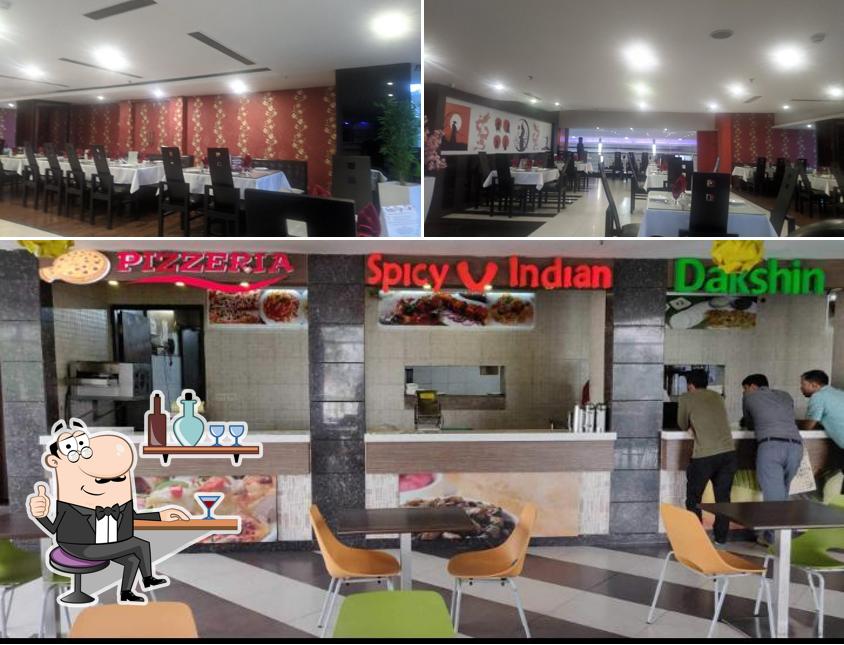 Take a seat at one of the tables at Lemon And Ice