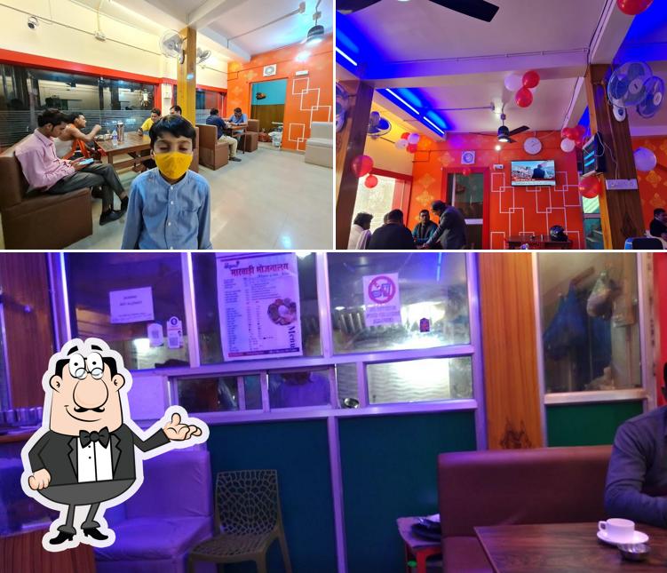 Take a seat at one of the tables at SHRIKRISHNA MARWARI BHOJNALAYA and FAMILY RESTAURENT